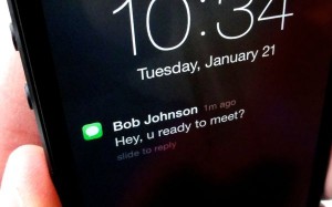 iOS 7 lock-screen notification. iOS alerts, pop-ups, and badges.