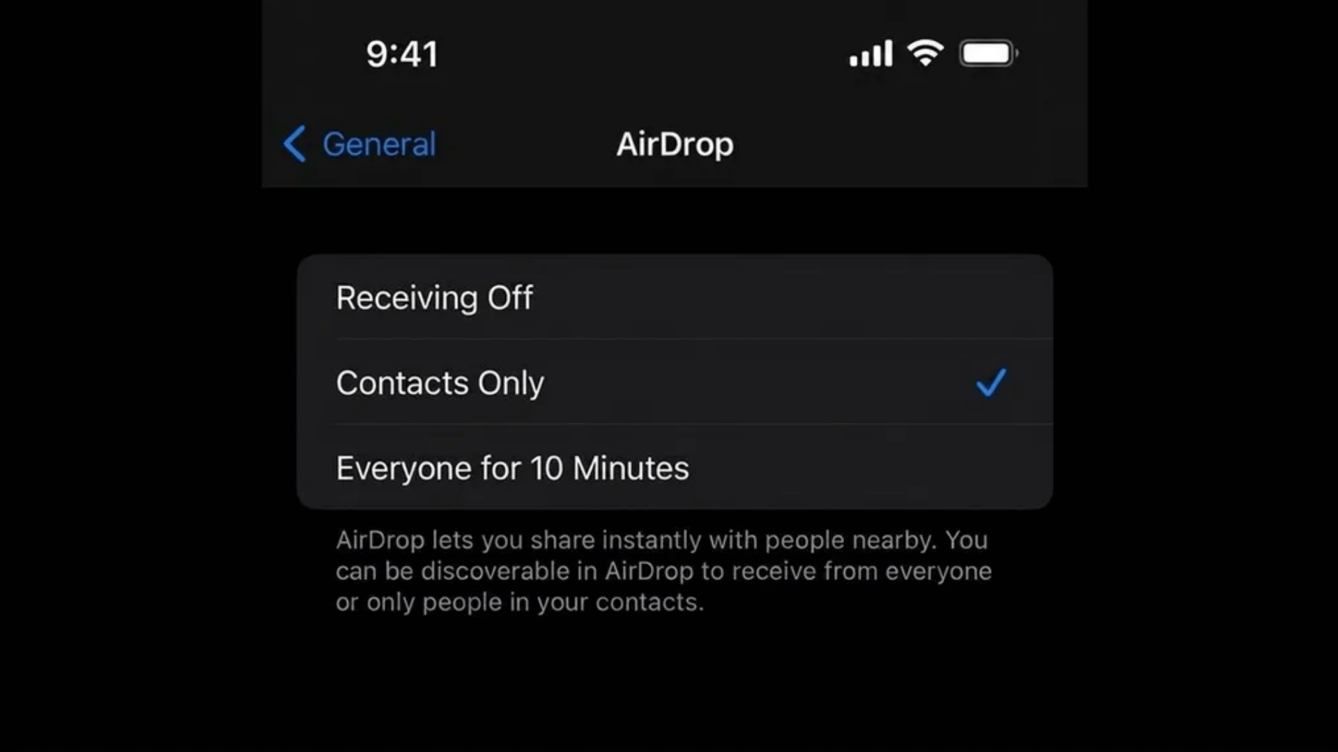iPhone AirDrop settings screen in dark mode showing Contacts Only selected, with Receiving Off and Everyone for 10 Minutes options.