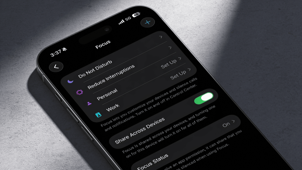 iPhone Focus settings with Do Not Disturb, Reduce Interruptions, Personal, Work, Share Across Devices, Focus Status toggle