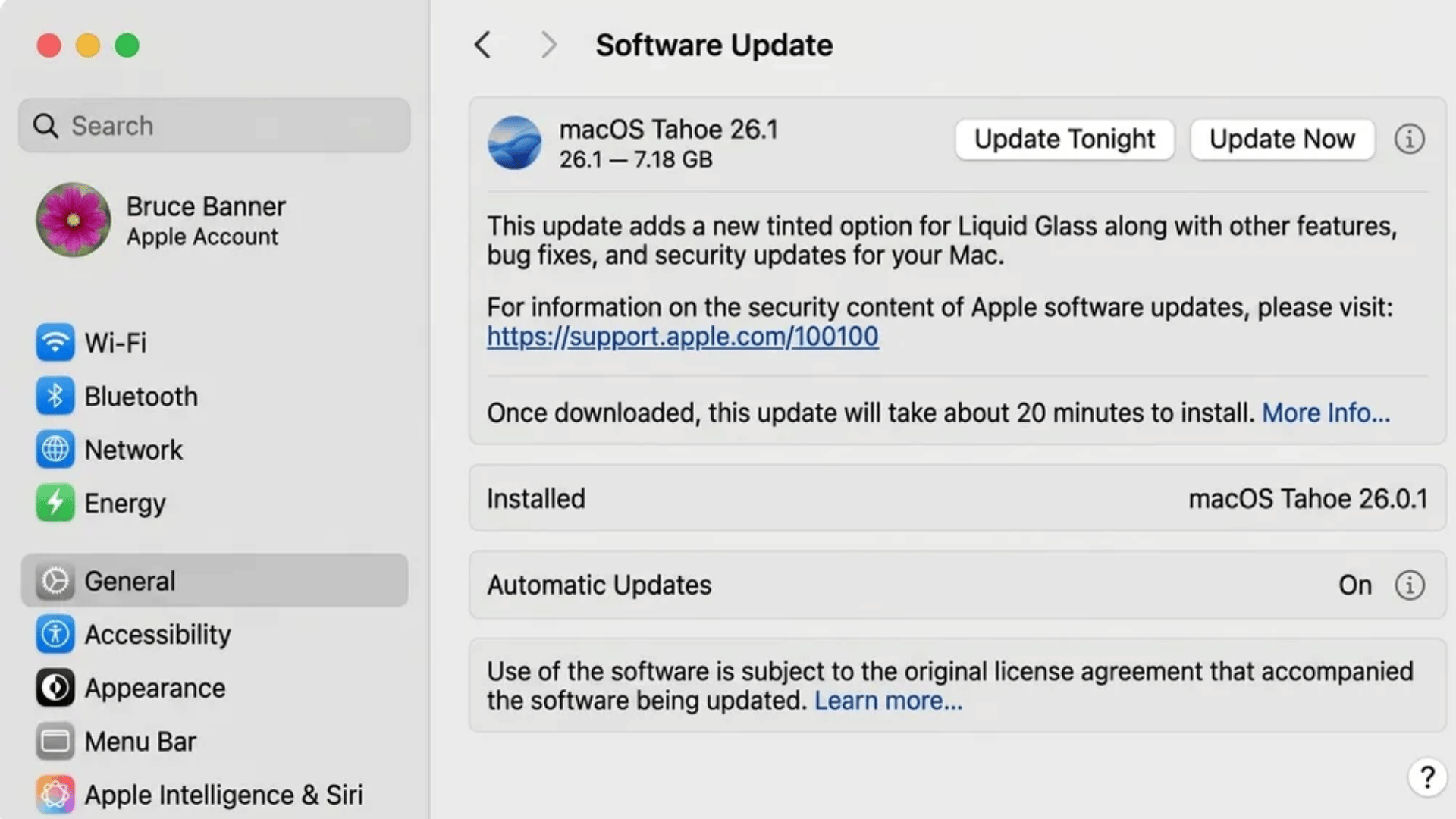 macOS System Settings Software Update screen showing macOS Tahoe 26.1 update with options like Update Now and Update Tonight, alongside automatic updates and installed version details.