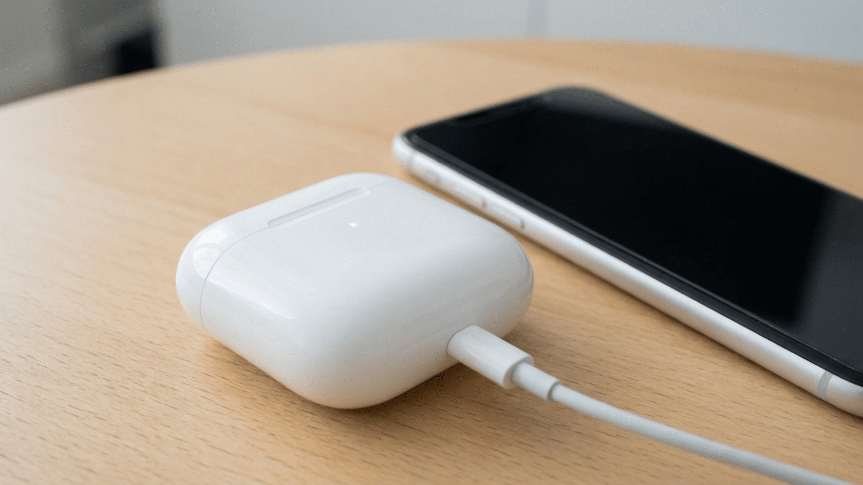 Case kept near iPhone, showing how to update airpod firmware properly