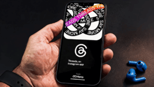 Hand holding smartphone showing a social media profile browsing screen