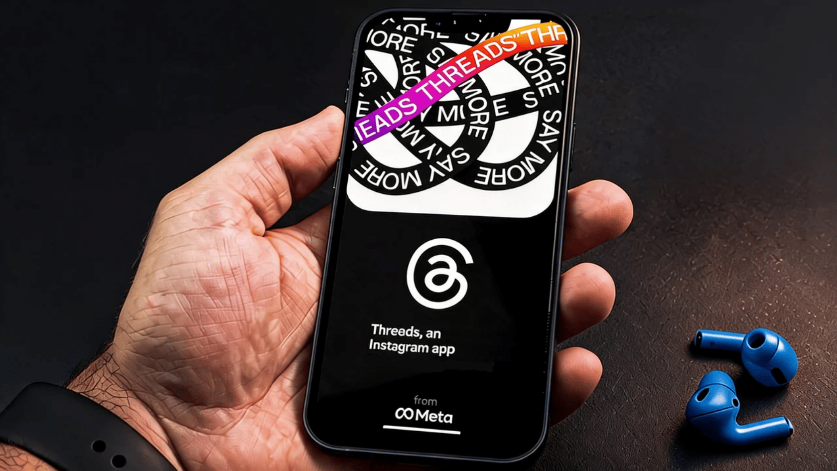 Hand holding smartphone showing a social media profile browsing screen