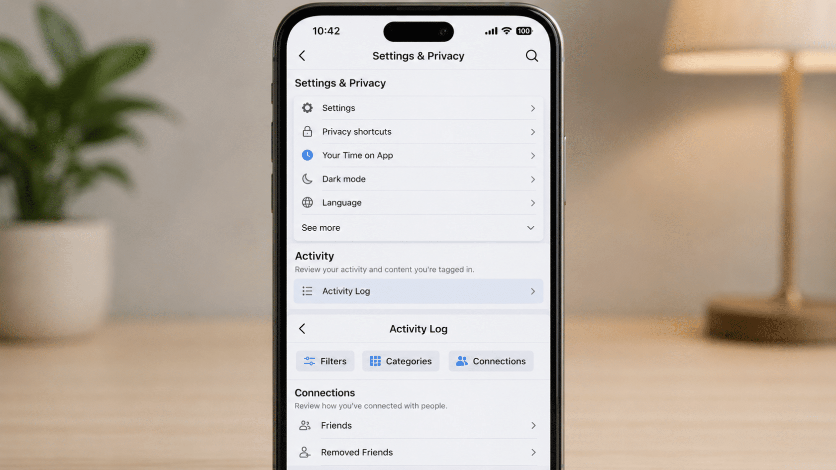 Mobile settings screen showing activity log navigation with filters, connections, friends, and removed friends sections