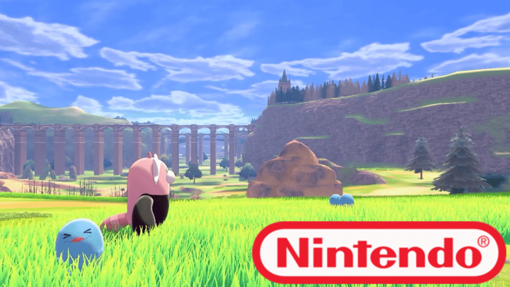 Pokémon creatures standing in a grassy field with a bridge and landscape background in a Nintendo game scene.