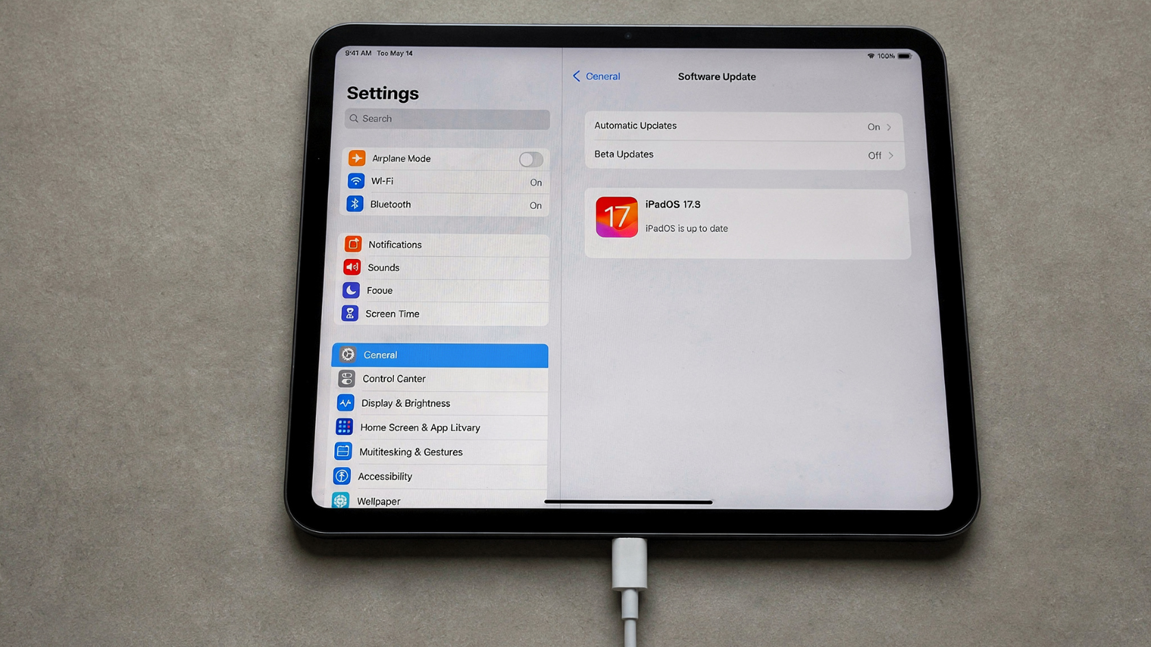iPad with USB-C cable plugged in showing Software Update screen to fix why does my iPad say not charging