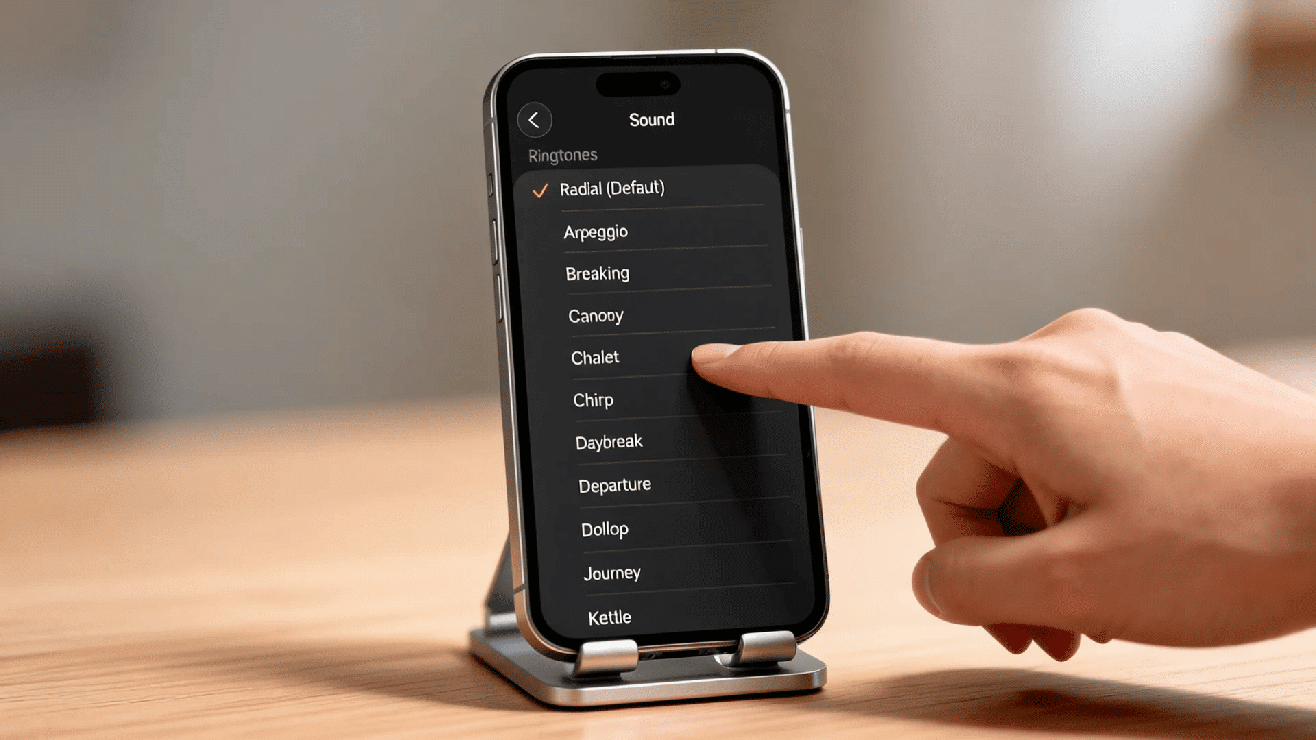 how to change alarm sound on iphone with iPhone Sound settings showing ringtone list and hand touching screen