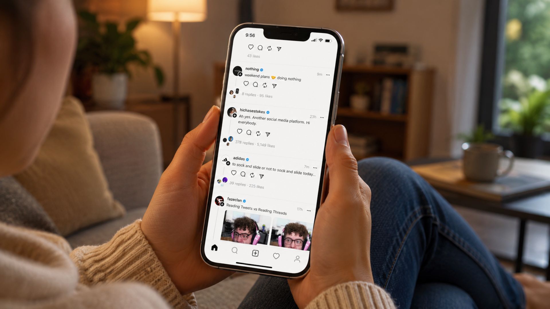 how does threads work? person using Threads app on smartphone showing posts, replies, likes, and feed features