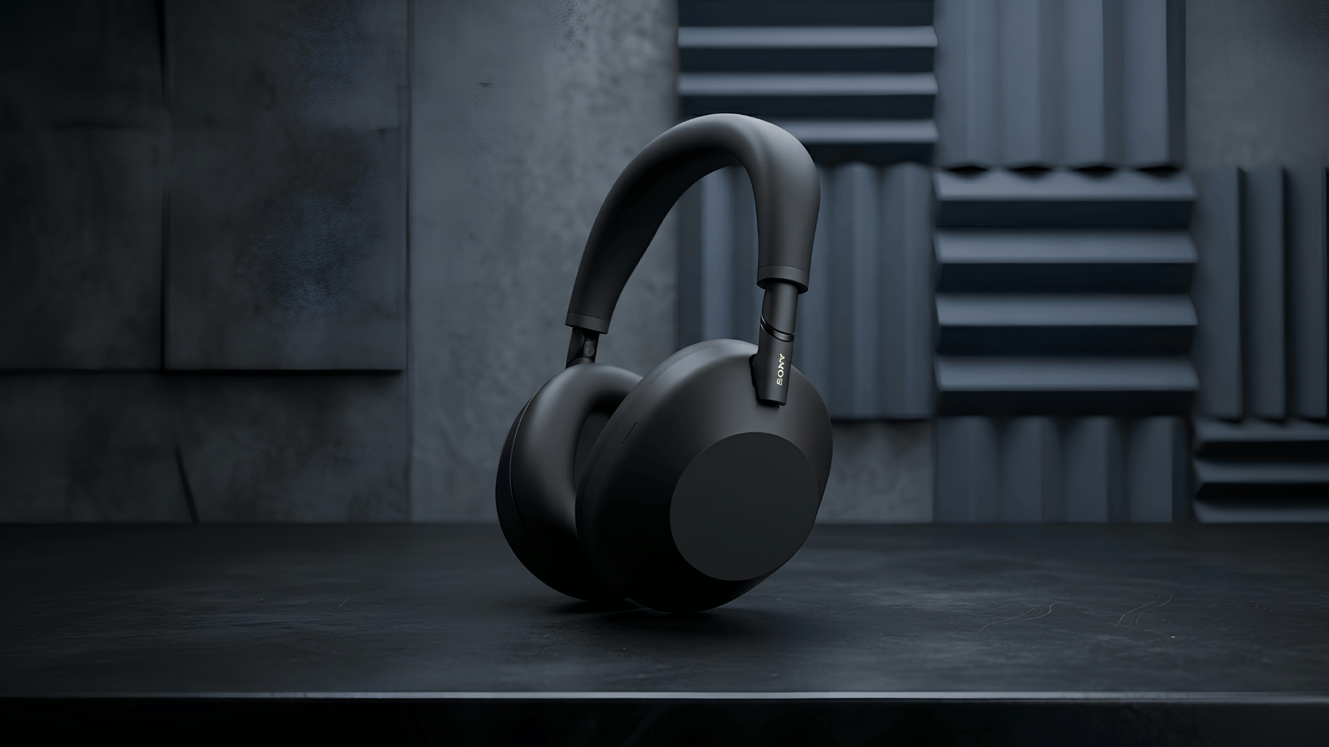 Black Sony WH-1000XM6 over-ear headphones displayed against dark acoustic wall panels.