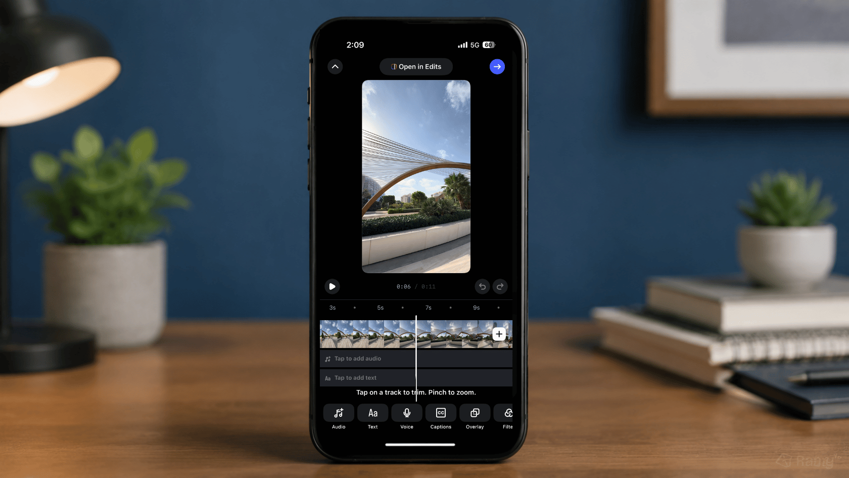 iPhone showing a video editing screen with a selected camera roll clip and timeline controls for uploading a Reel